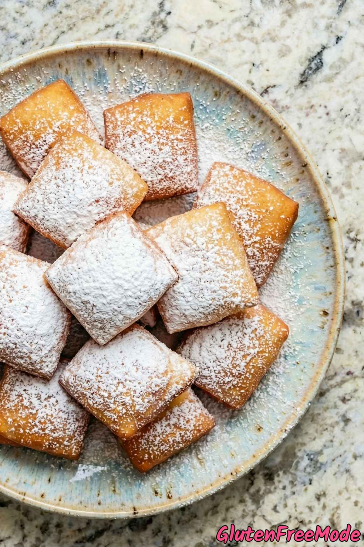 Pillowy gluten free beignets served warm