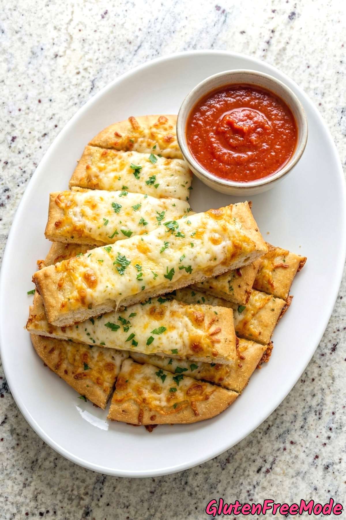 Fluffy gluten free cheesy breadsticks stacked up
