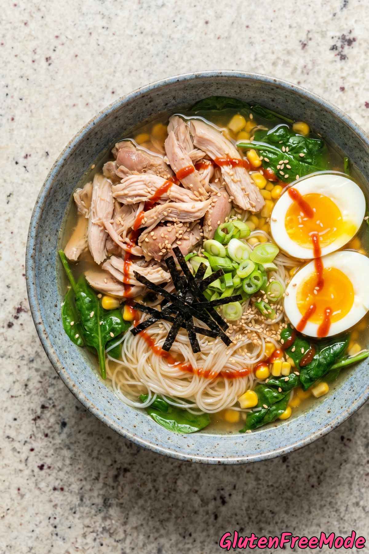 Warm gluten free chicken ramen with toppings