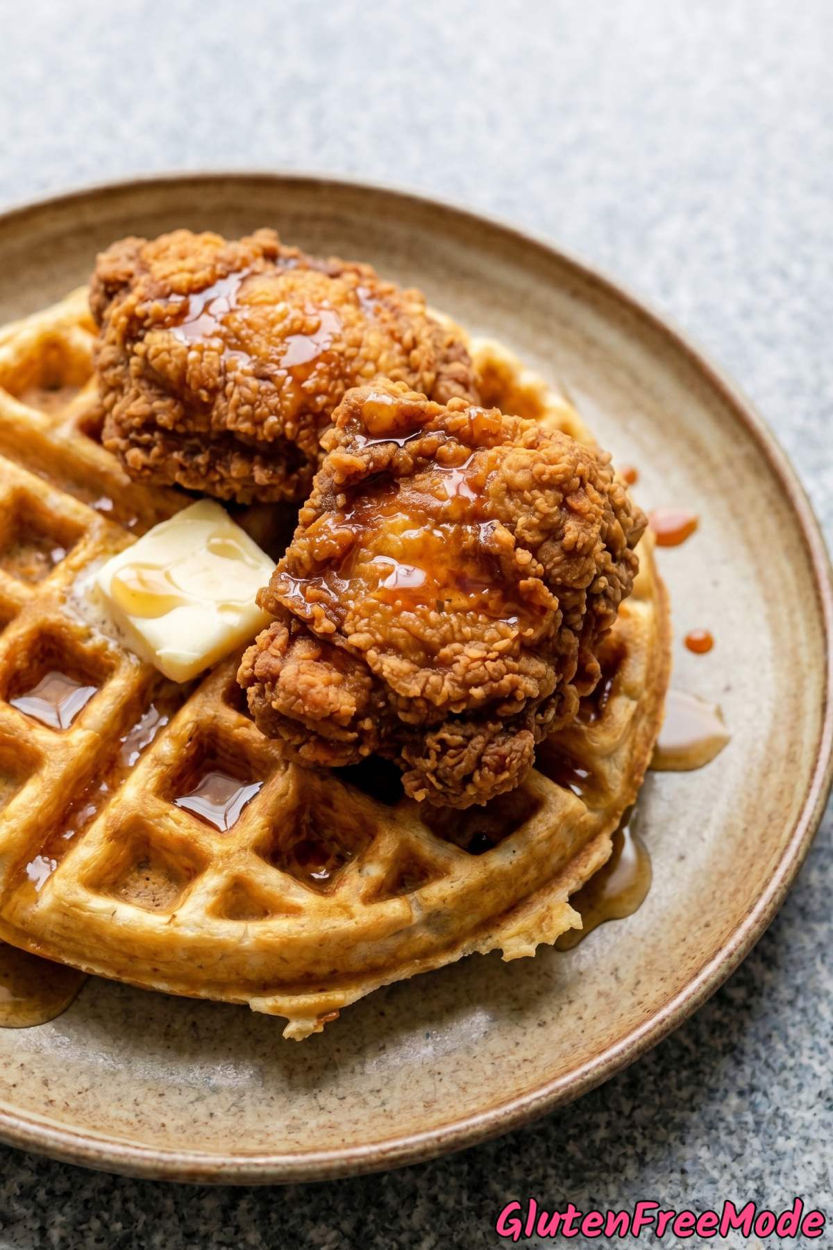 Juicy gluten free chicken on warm waffles
