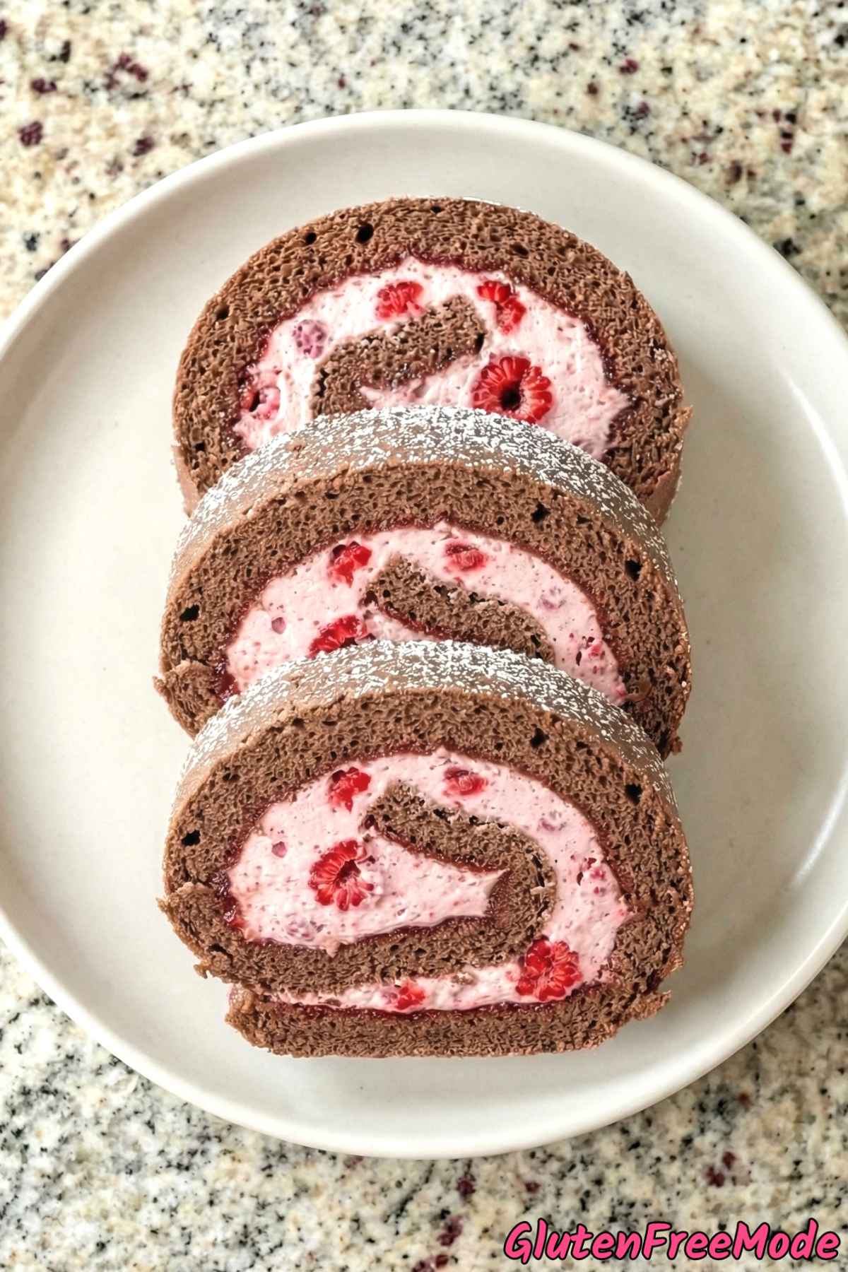 Fluffy gluten free chocolate raspberry swiss roll