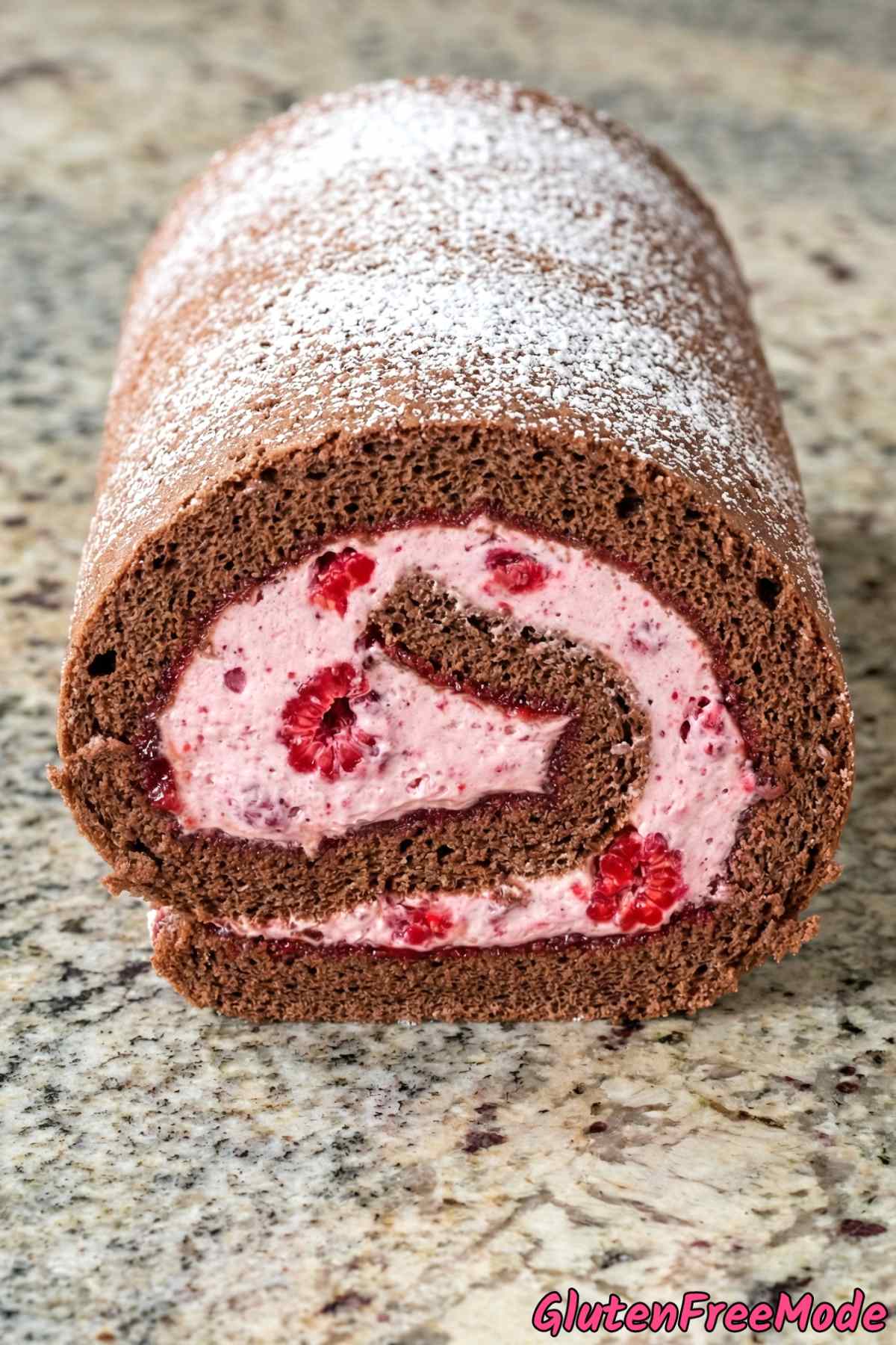 Indulgent gluten free raspberry swiss roll