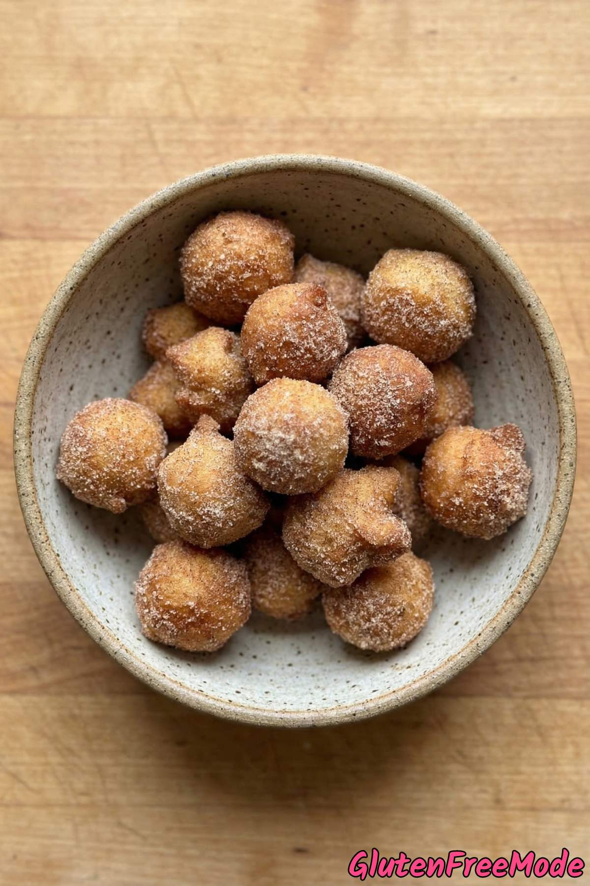 Fluffy gluten free churro bites on parchment