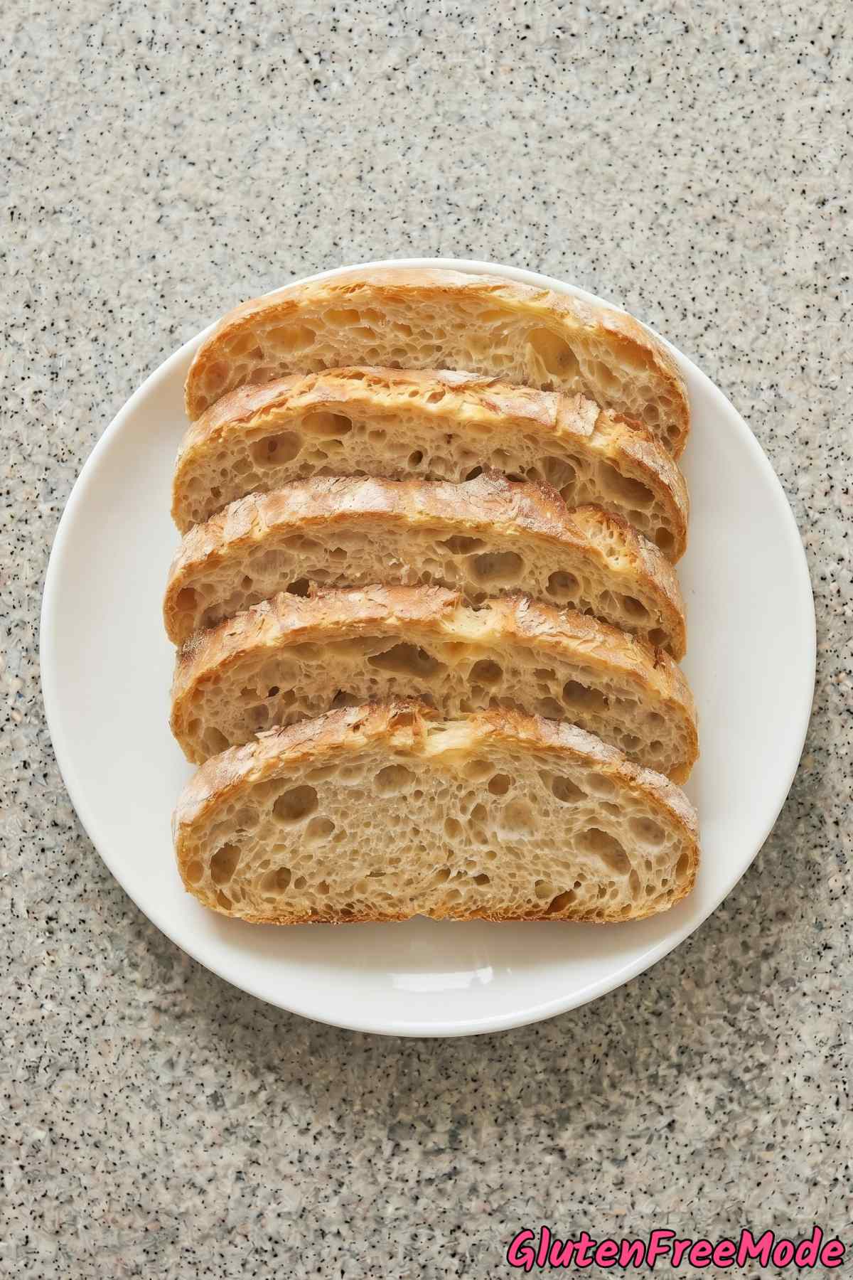 Airy gluten free ciabatta bread on board