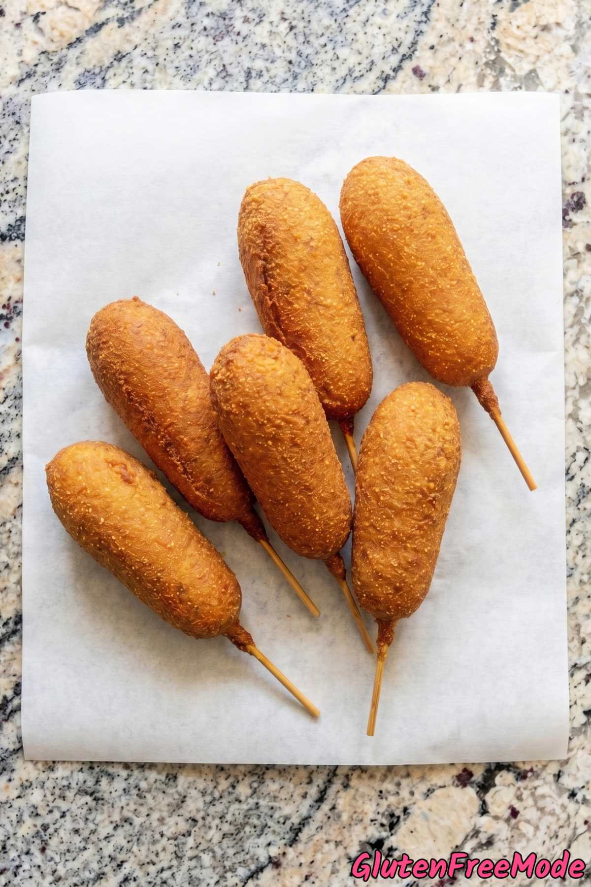 Homemade gluten free corn dogs stacked up