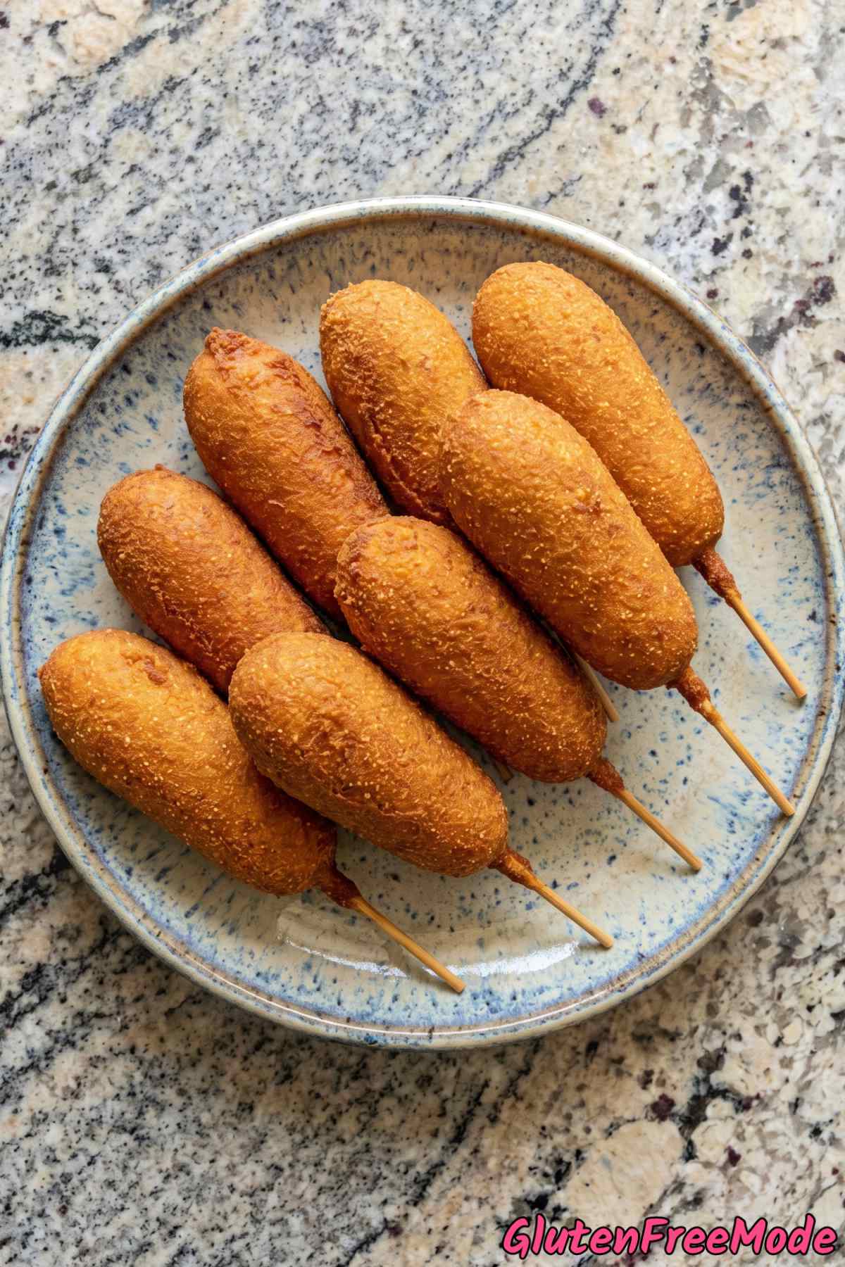 Savory gluten free corn dogs on parchment