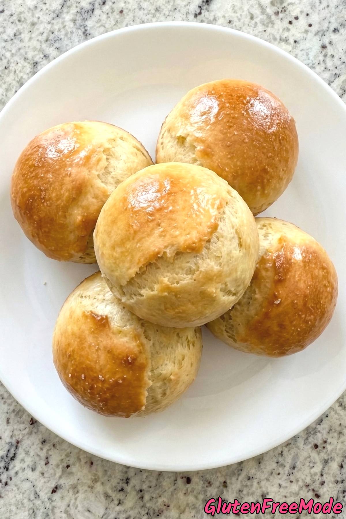Tender gluten free fluffy dinner rolls on tray