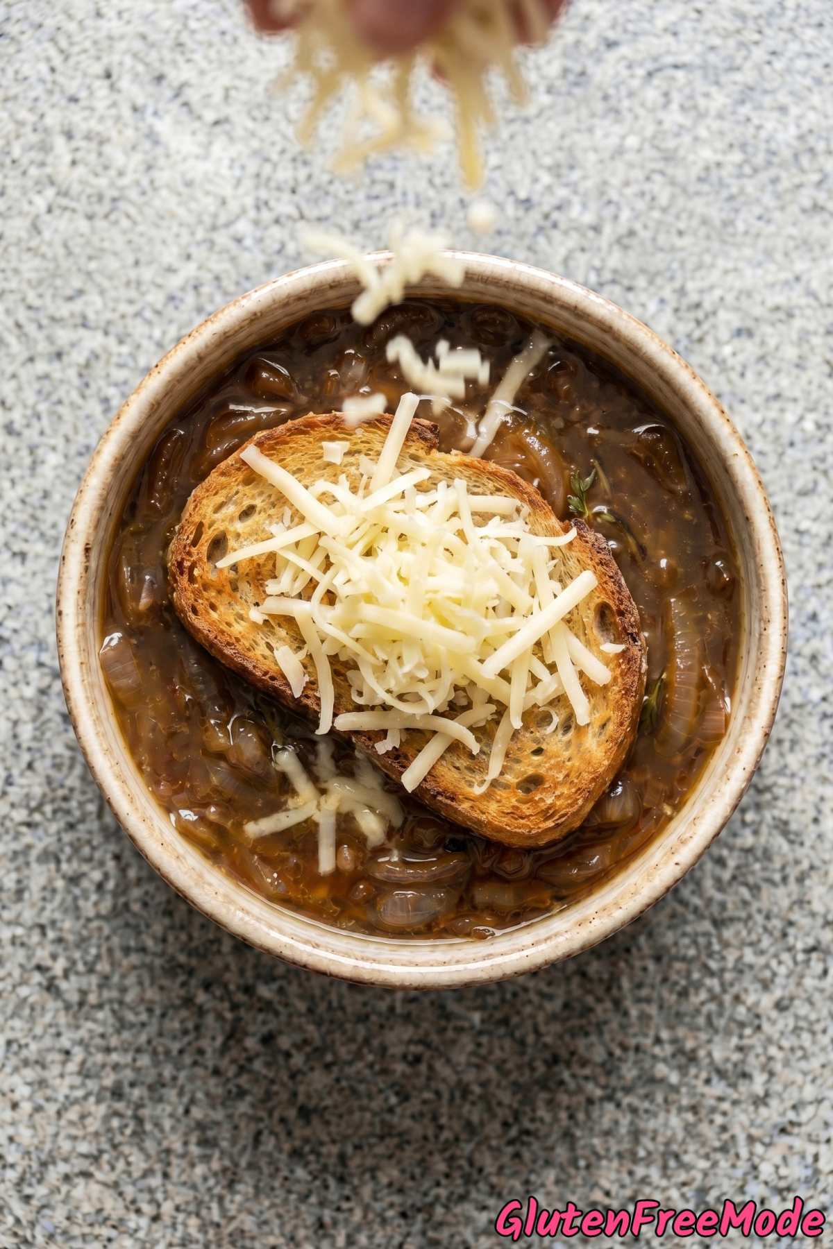 Warm gluten free French onion soup bowl