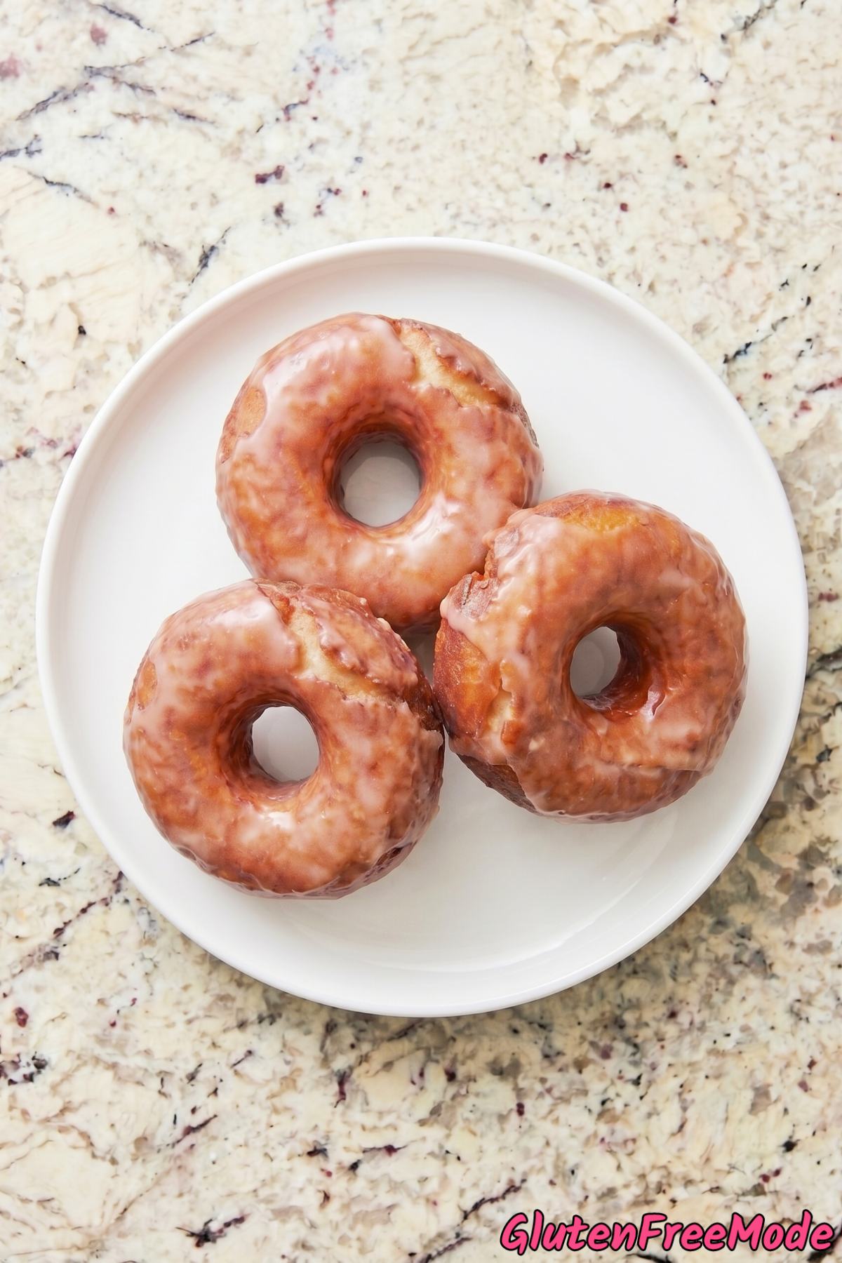 Decadent gluten free glazed donuts on rack