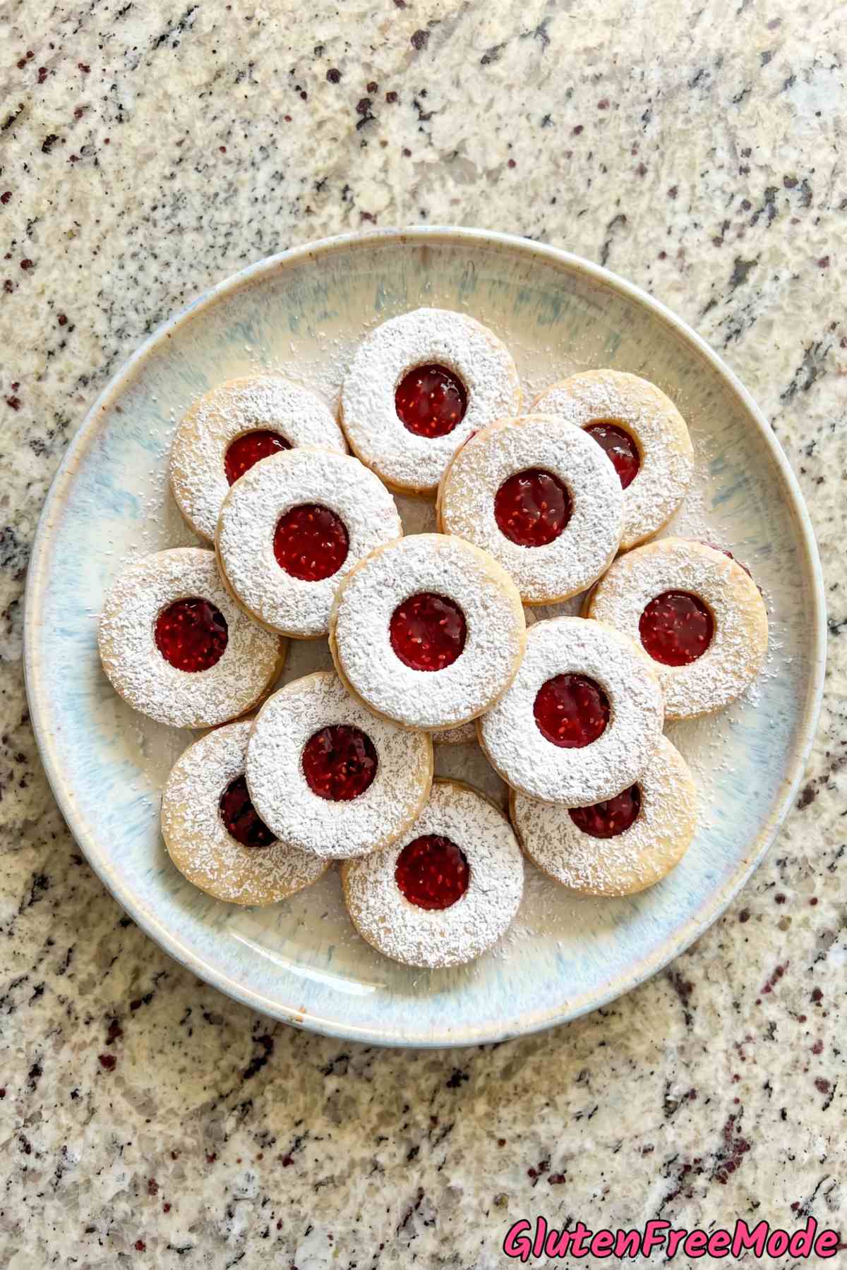 Sweet gluten free linzer cookies on parchment