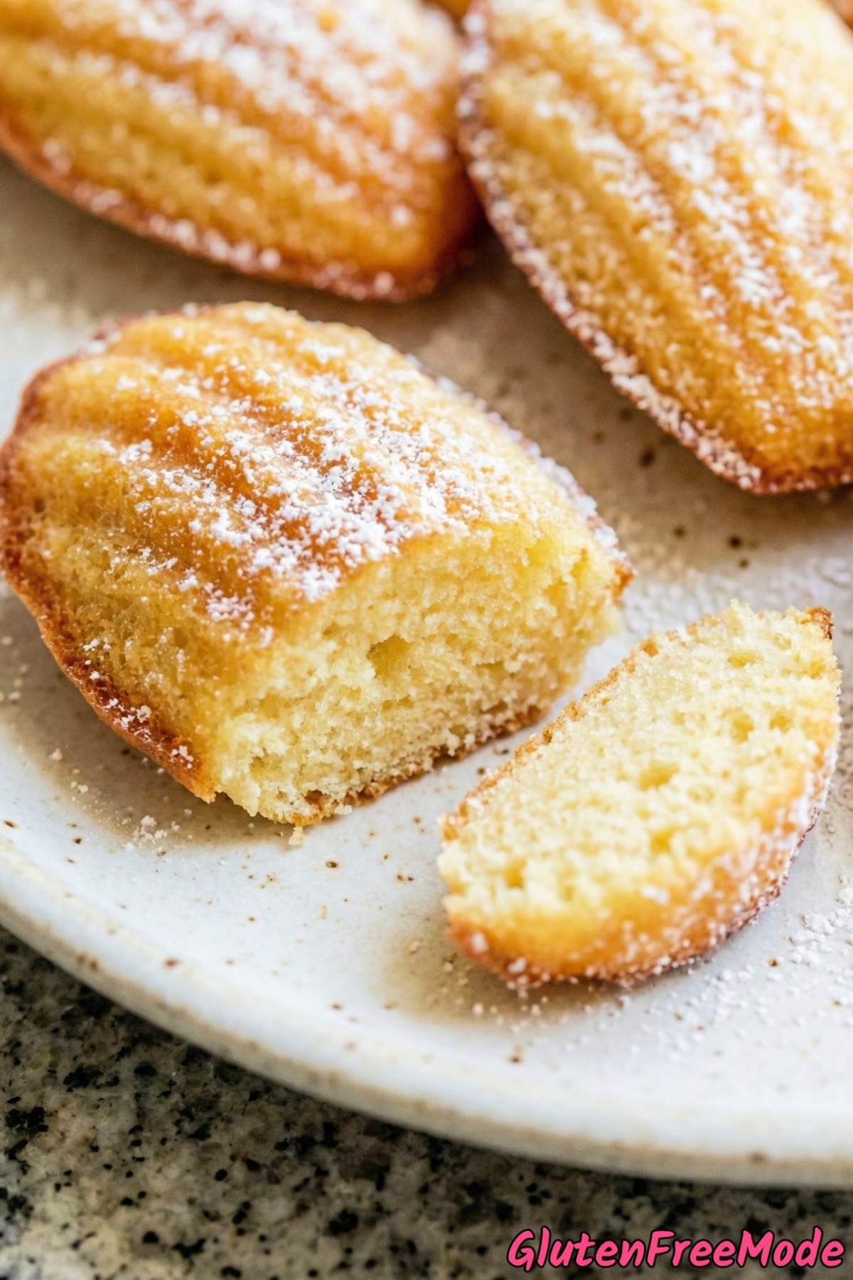 Fluffy gluten free madeleines on parchment