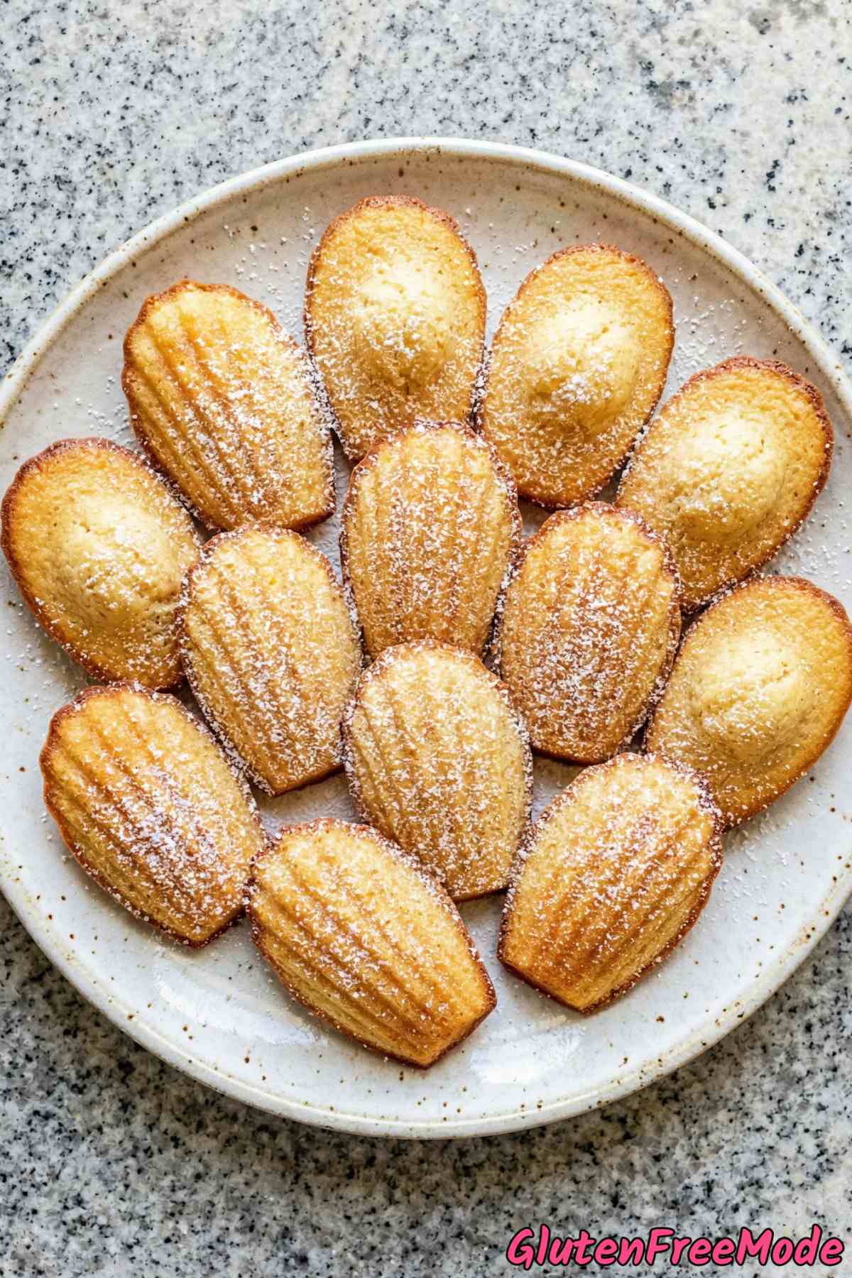 Homemade gluten free madeleines on a rack
