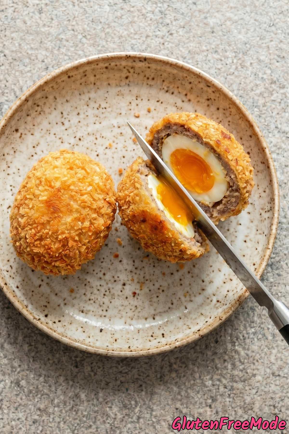 Golden gluten free scotch eggs sliced open